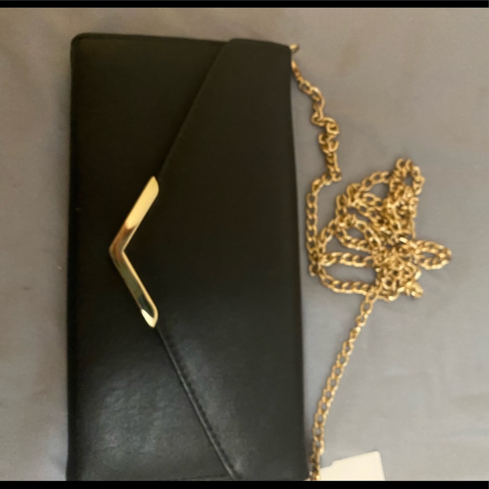 Sleek black wallet on chain crossbody bag